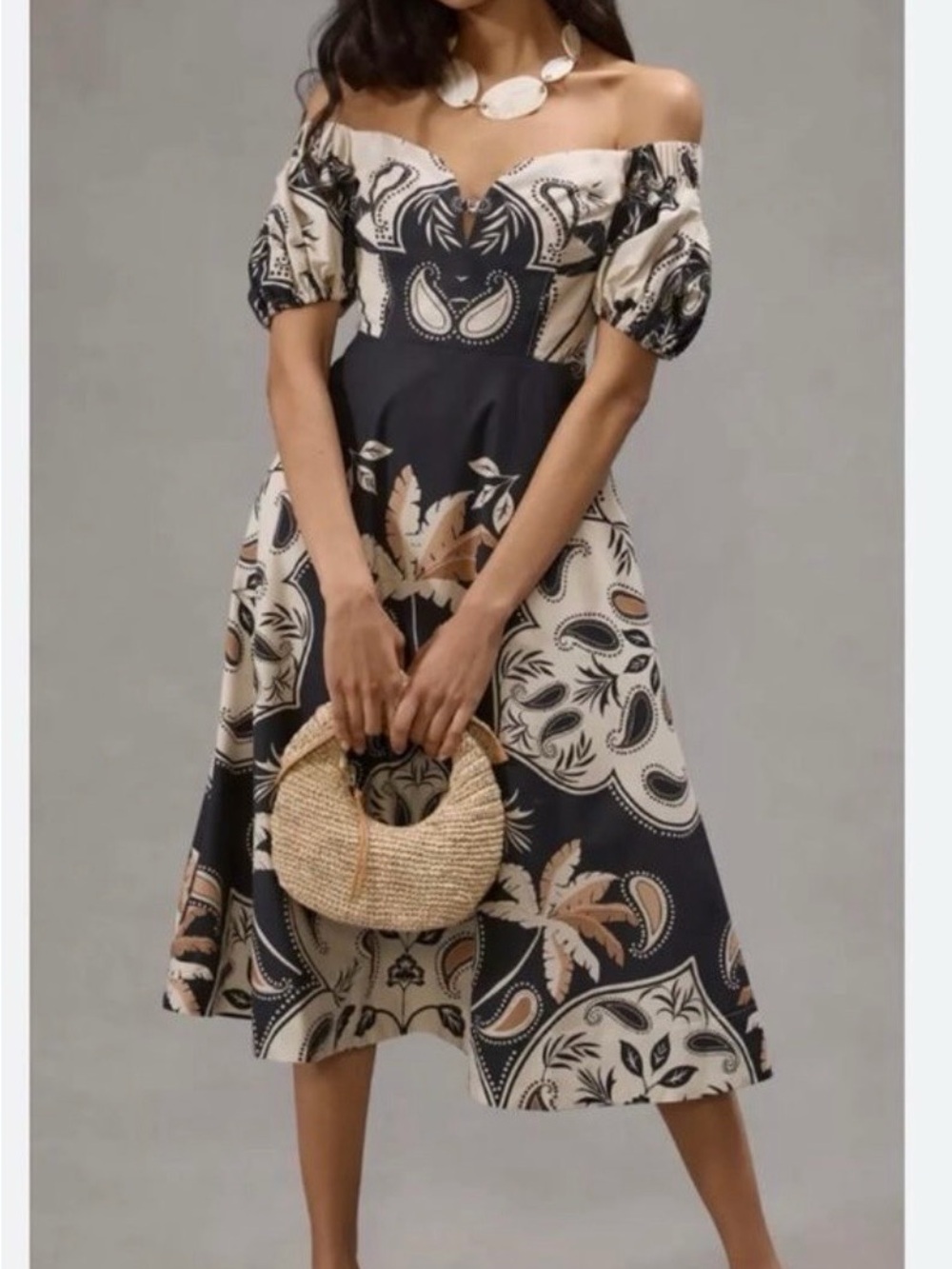 Anthropologie’s Maeve off-Shoulder Black and Cream Tropical Printed Midi Dress
